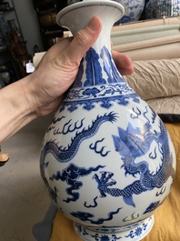 A Chinese blue and white 'yuhuchunping' 'dragon' vase on wooden stand, Qianlong mark, 19/20th C.