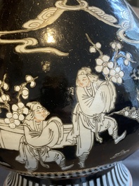 A Chinese famille noire vase with grisaille and iron-red design, 19th C.