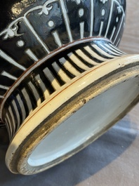 A Chinese famille noire vase with grisaille and iron-red design, 19th C.