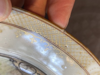A fine Chinese famille rose plate with two ladies and two boys in an interior, Yongzheng/Qianlong