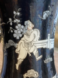 A Chinese famille noire vase with grisaille and iron-red design, 19th C.