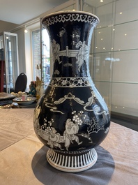 A Chinese famille noire vase with grisaille and iron-red design, 19th C.