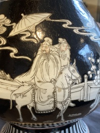 A Chinese famille noire vase with grisaille and iron-red design, 19th C.