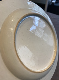 A fine Chinese famille rose plate with two ladies and two boys in an interior, Yongzheng/Qianlong