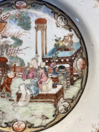 A fine Chinese famille rose plate with two ladies and two boys in an interior, Yongzheng/Qianlong