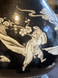 A Chinese famille noire vase with grisaille and iron-red design, 19th C.