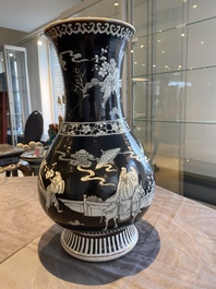 A Chinese famille noire vase with grisaille and iron-red design, 19th C.