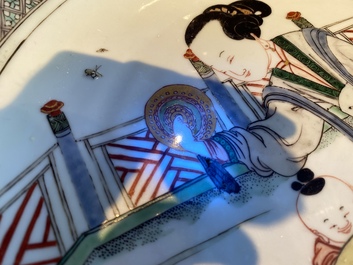 A Chinese famille verte dish with a lady and two playing boys, Kangxi