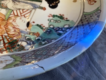 A Chinese famille verte dish with a lady and two playing boys, Kangxi