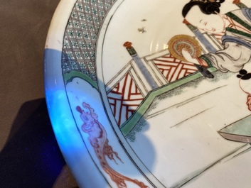 A Chinese famille verte dish with a lady and two playing boys, Kangxi