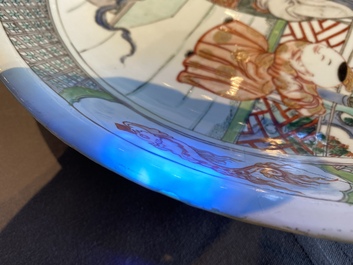 A Chinese famille verte dish with a lady and two playing boys, Kangxi