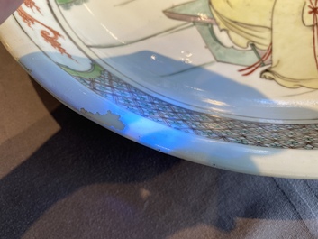 A Chinese famille verte dish with a lady and two playing boys, Kangxi