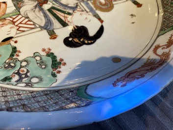 A Chinese famille verte dish with a lady and two playing boys, Kangxi