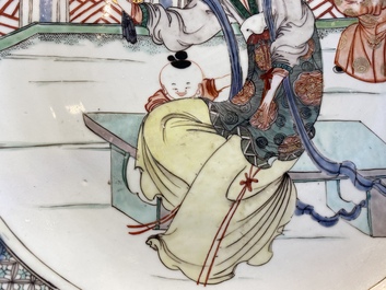 A Chinese famille verte dish with a lady and two playing boys, Kangxi