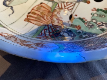 A Chinese famille verte dish with a lady and two playing boys, Kangxi