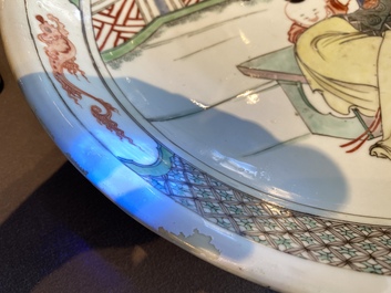 A Chinese famille verte dish with a lady and two playing boys, Kangxi