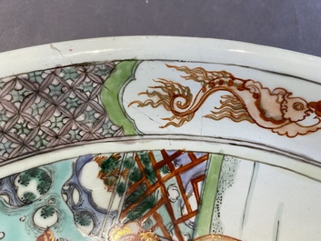 A Chinese famille verte dish with a lady and two playing boys, Kangxi