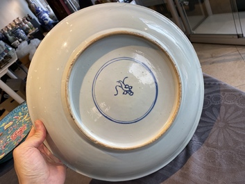 A Chinese famille verte dish with a lady and two playing boys, Kangxi