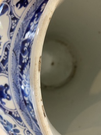 A large Chinese blue and white garniture of three vases, Kangxi