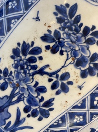 A large Chinese blue and white garniture of three vases, Kangxi