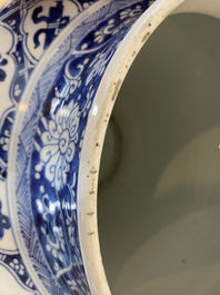 A large Chinese blue and white garniture of three vases, Kangxi