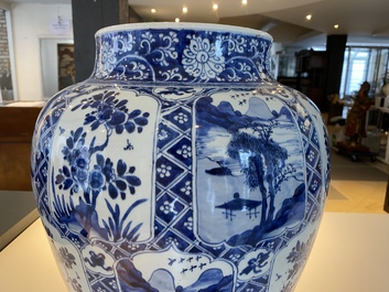 A large Chinese blue and white garniture of three vases, Kangxi