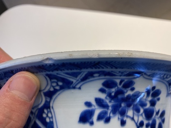 A large Chinese blue and white garniture of three vases, Kangxi