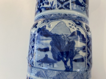 A large Chinese blue and white garniture of three vases, Kangxi