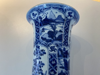 A large Chinese blue and white garniture of three vases, Kangxi