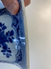 A large Chinese blue and white garniture of three vases, Kangxi