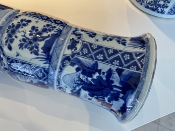 A large Chinese blue and white garniture of three vases, Kangxi