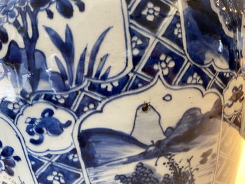 A large Chinese blue and white garniture of three vases, Kangxi