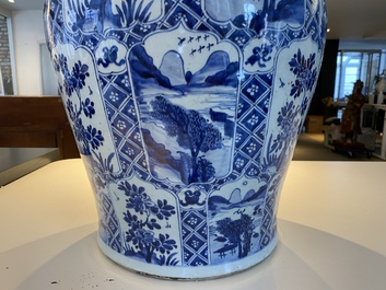 A large Chinese blue and white garniture of three vases, Kangxi