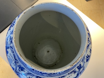 A large Chinese blue and white garniture of three vases, Kangxi