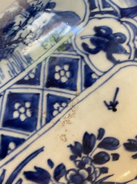 A large Chinese blue and white garniture of three vases, Kangxi