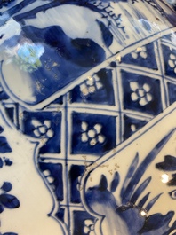 A large Chinese blue and white garniture of three vases, Kangxi