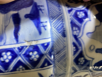 A large Chinese blue and white garniture of three vases, Kangxi