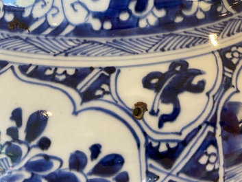 A large Chinese blue and white garniture of three vases, Kangxi