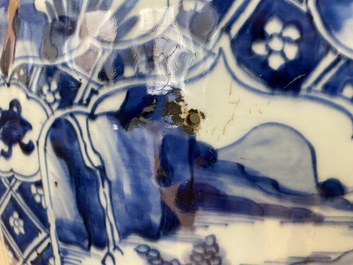 A large Chinese blue and white garniture of three vases, Kangxi
