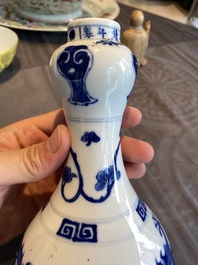 A Chinese blue and white 'dragons' bottle vase, Jiajing mark, 19/20th C.