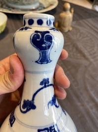 A Chinese blue and white 'dragons' bottle vase, Jiajing mark, 19/20th C.