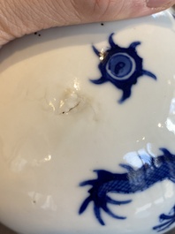 A Chinese blue and white 'dragons' bottle vase, Jiajing mark, 19/20th C.