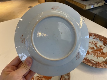 A Chinese blue and white 'dragon' dish and three iron-red and famille rose plates, 18th C.