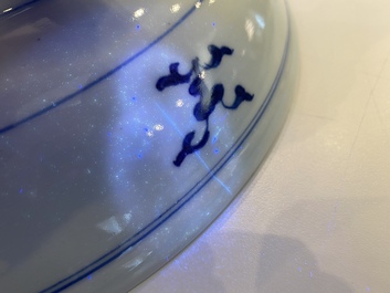 A Chinese blue and white 'dragon' dish and three iron-red and famille rose plates, 18th C.