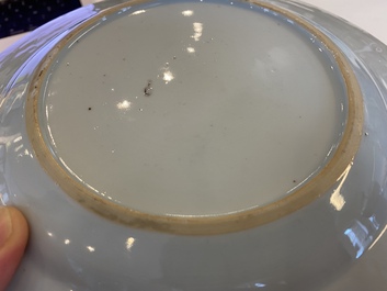 A Chinese blue and white 'dragon' dish and three iron-red and famille rose plates, 18th C.