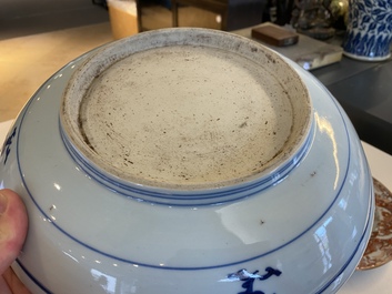 A Chinese blue and white 'dragon' dish and three iron-red and famille rose plates, 18th C.