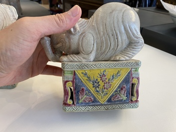 A pair of Chinese famille rose elephants on stands, 20th C.