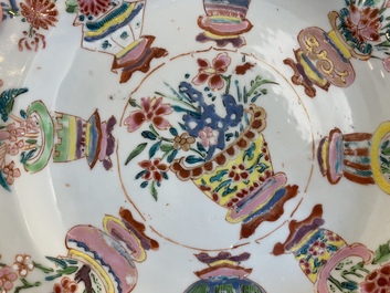 A Chinese blue and white 'dragon' dish and three iron-red and famille rose plates, 18th C.
