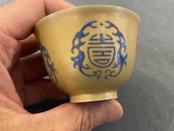 A Chinese blue enamel on gilt &lsquo;Shou&rsquo; tea bowl, 18/19th C.
