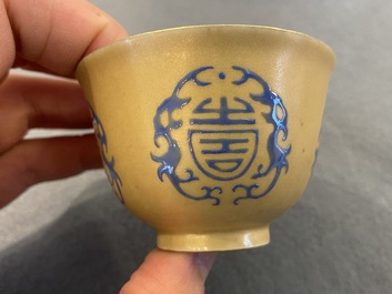 A Chinese blue enamel on gilt &lsquo;Shou&rsquo; tea bowl, 18/19th C.